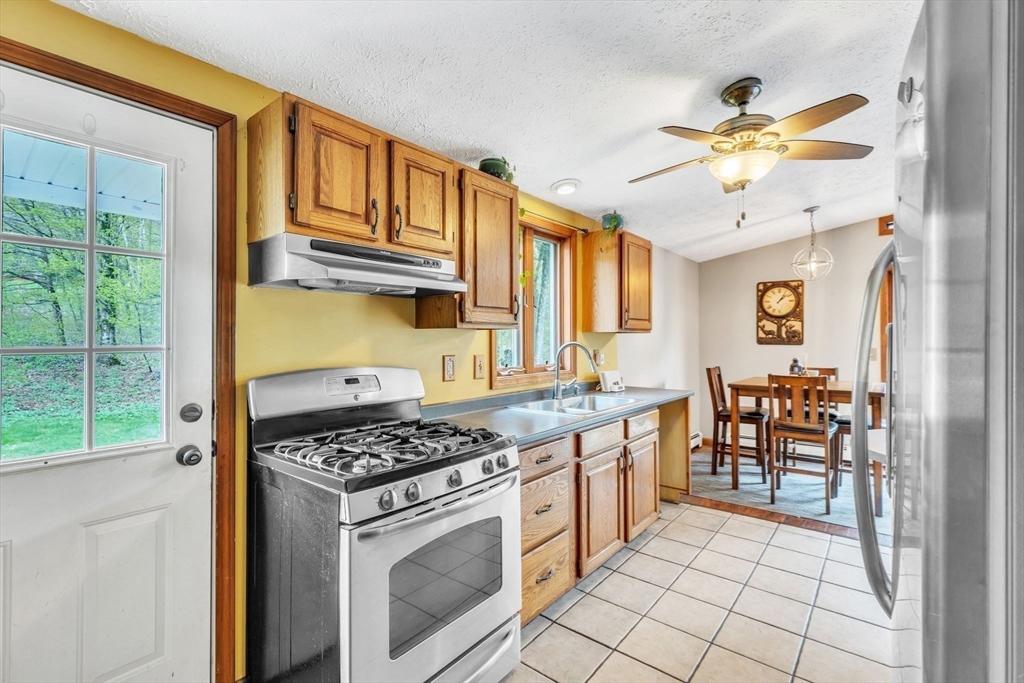 583 Main Road Chesterfield, MA 01012 - Photo 2 of 21 a kitchen with stainless steel appliances granite countertop a stove and a refrigerator