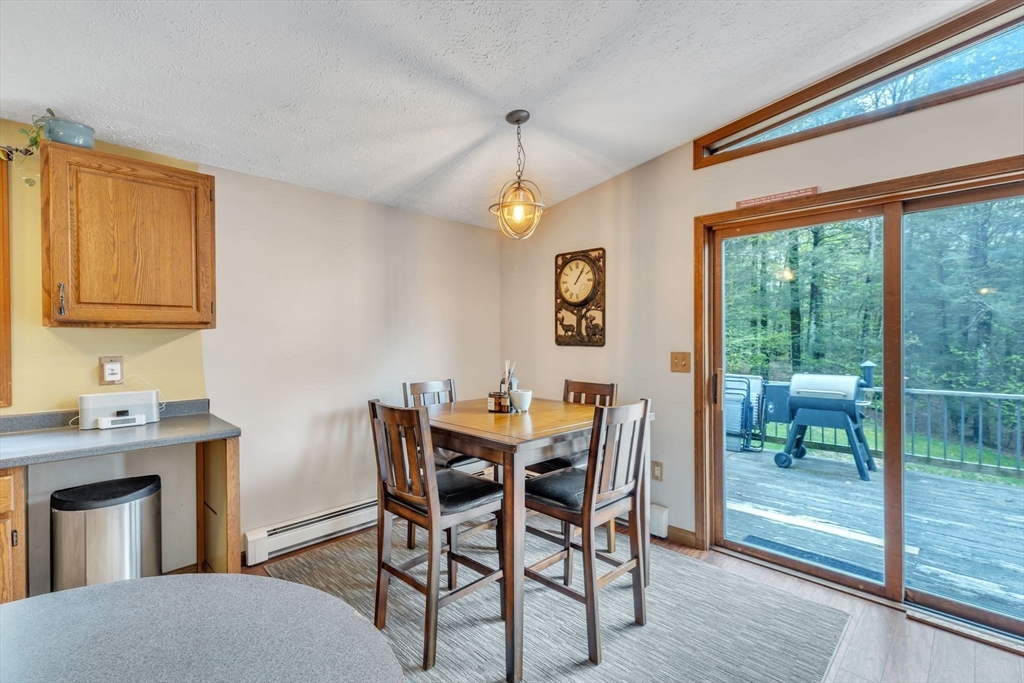 583 Main Road Chesterfield, MA 01012 - Photo 3 of 21 a view of a dining room with furniture window and wooden floor