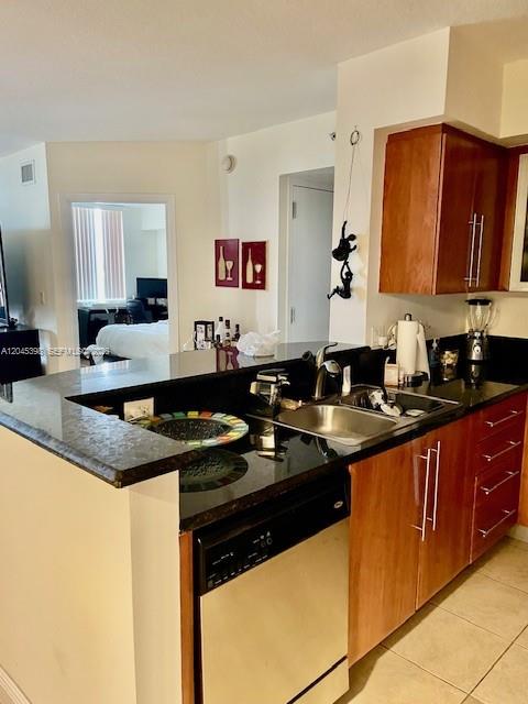 3232 Southwest 22nd Terrace, Unit 1303 Miami, FL 33145 - Photo 11 of 43 a kitchen with stainless steel appliances granite countertop a sink stove and cabinets