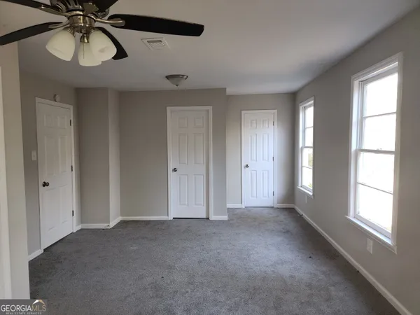 a view of a livingroom and window