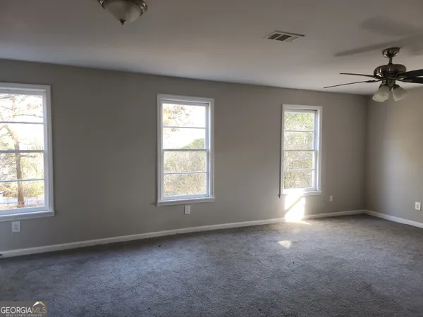 a view of a room that has a window