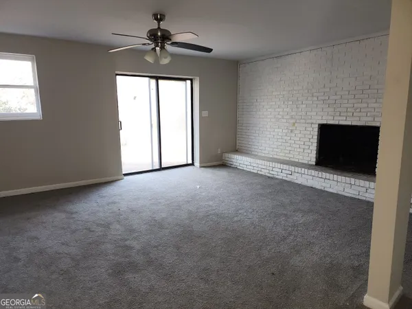 a view of empty room with windows