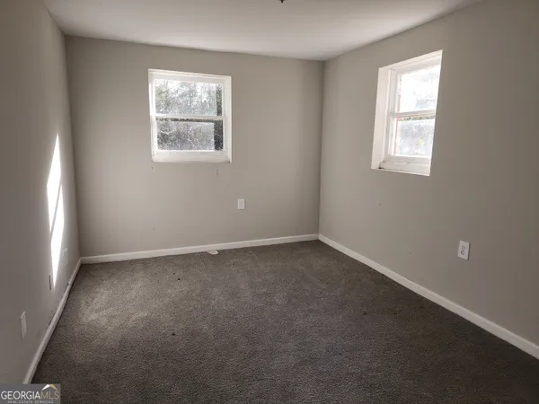 an empty room with windows