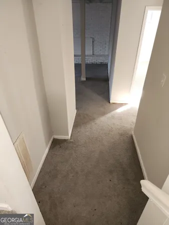 a view of an empty room and window