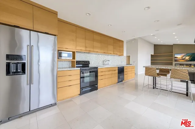 a room with table chairs and wooden floor