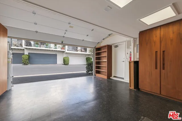 a view of a livingroom with furniture and a kitchen