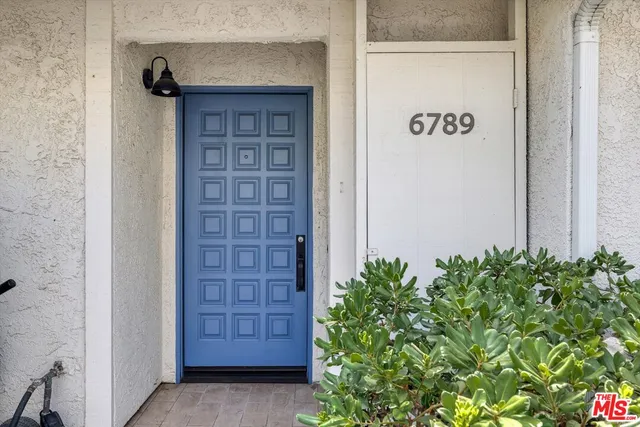 front view of a house with a garden
