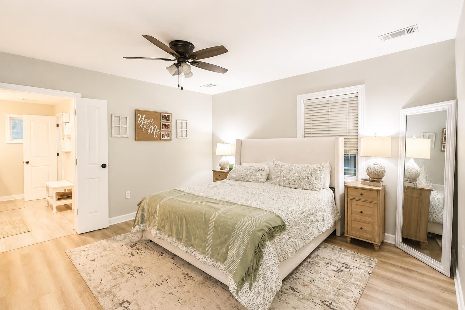 10093 Mt Carmel Road Brighton, TN 38011 - Photo 23 of 36 Spacious room featuring wood-finish flooring, a ceiling fan with light fixture, and a window with blinds