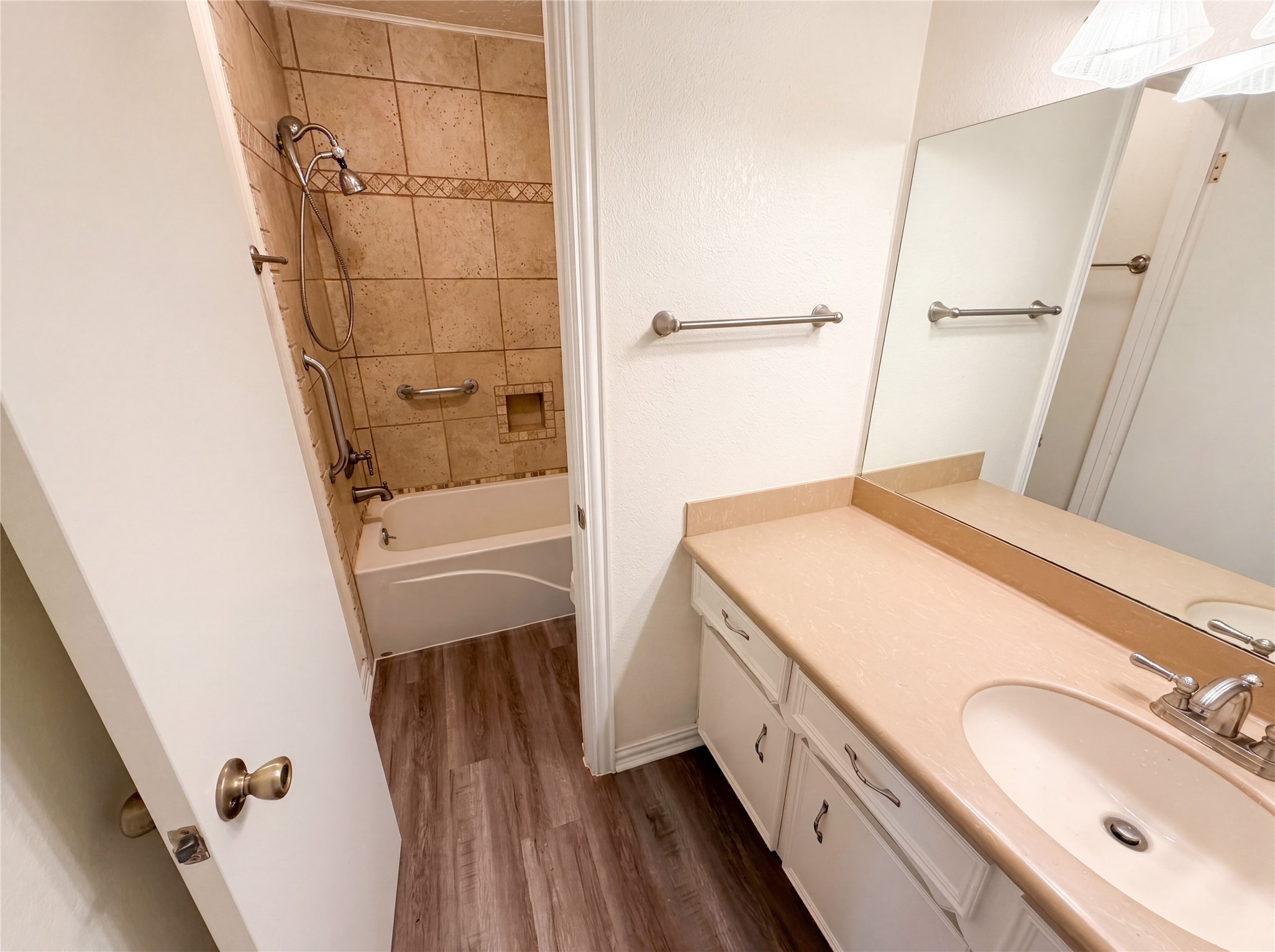 342 Queenstown Road Houston, TX 77015 - Photo 13 of 22 a bathroom with a sink a mirror and a shower
