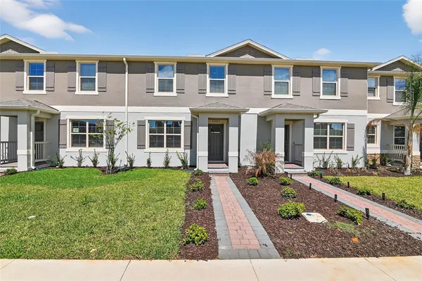 front view of a house with a yard