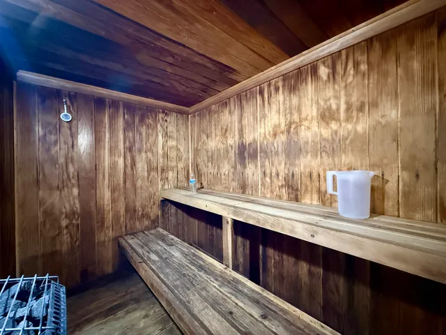 a view of an house with backyard space and tree