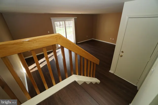 a view of an entryway with wooden floor