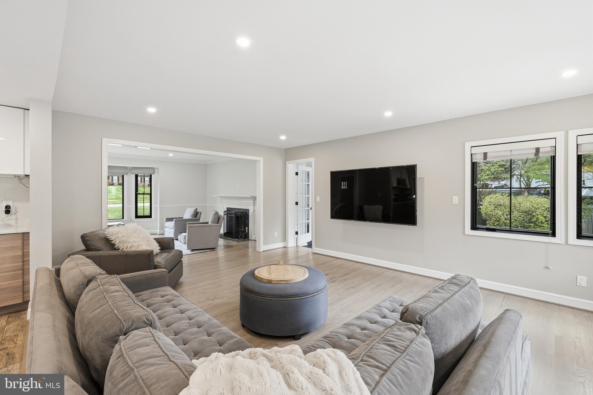 10712 Lockland Road Potomac, MD 20854 - Photo 14 of 66 a living room with furniture and a flat screen tv