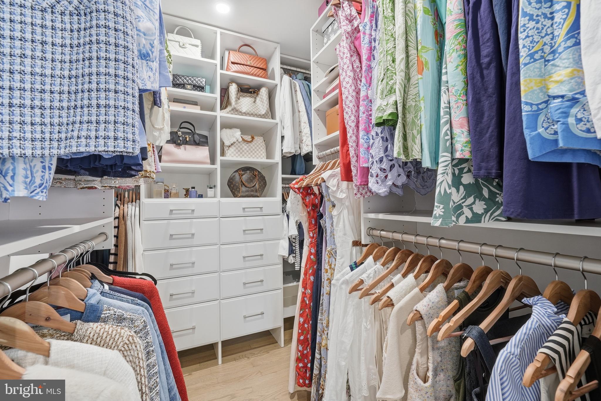 10712 Lockland Road Potomac, MD 20854 - Photo 27 of 66 a view of walk in closet with clothes and shoes