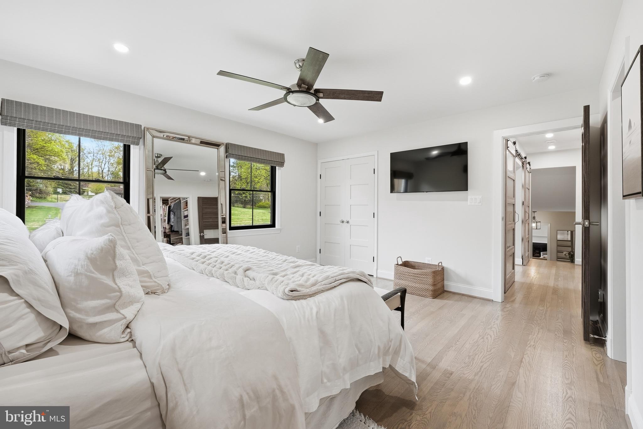 10712 Lockland Road Potomac, MD 20854 - Photo 28 of 66 a bedroom with a bed window and a flat screen tv