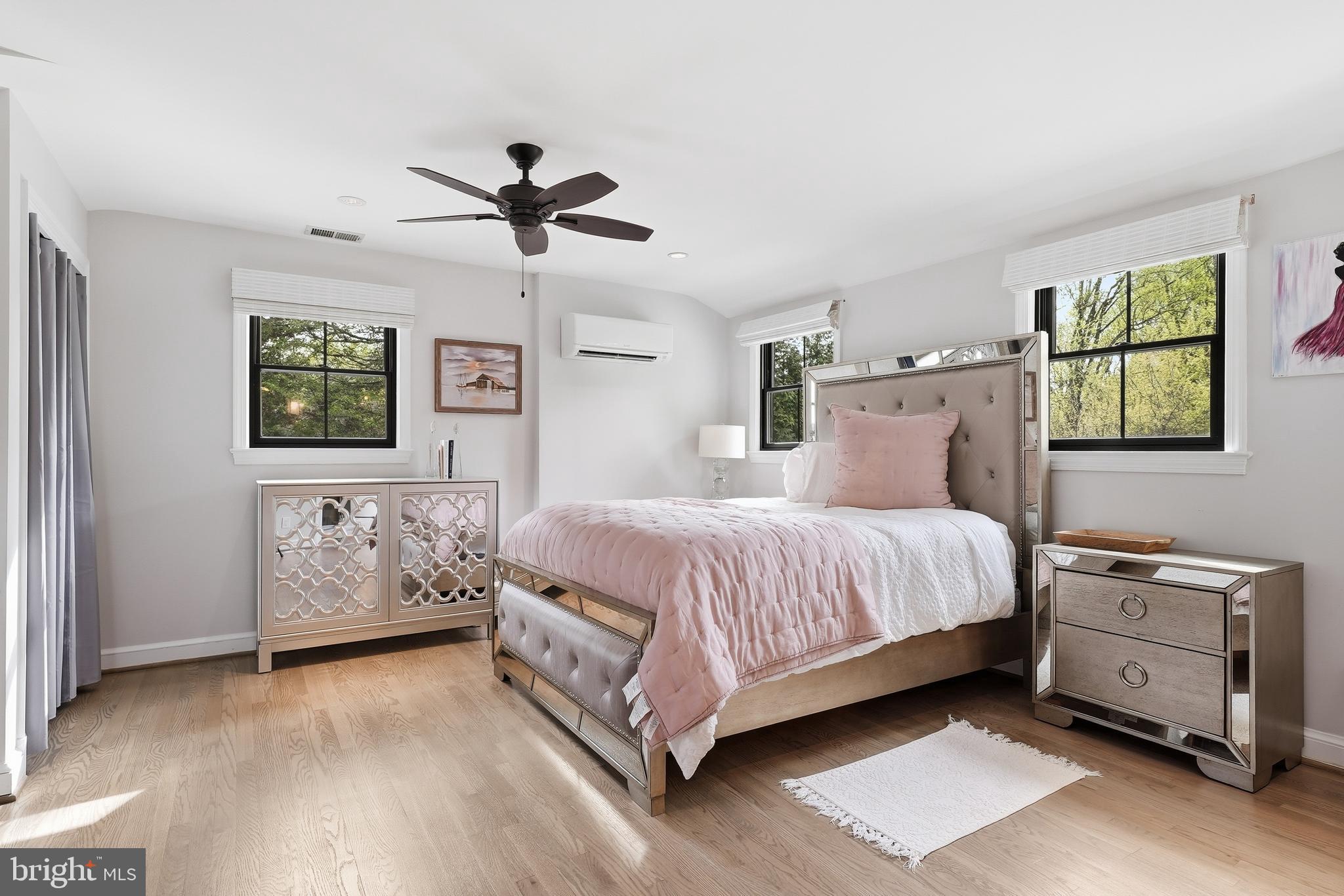 10712 Lockland Road Potomac, MD 20854 - Photo 36 of 66 a spacious bedroom with a bed and a baby crib