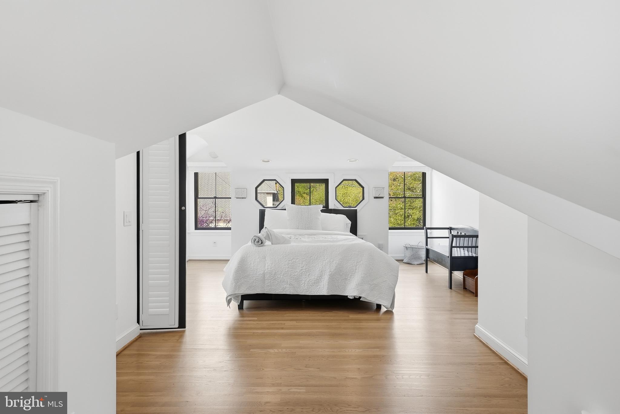 10712 Lockland Road Potomac, MD 20854 - Photo 41 of 66 a bedroom with a bed and a dresser with wooden floor