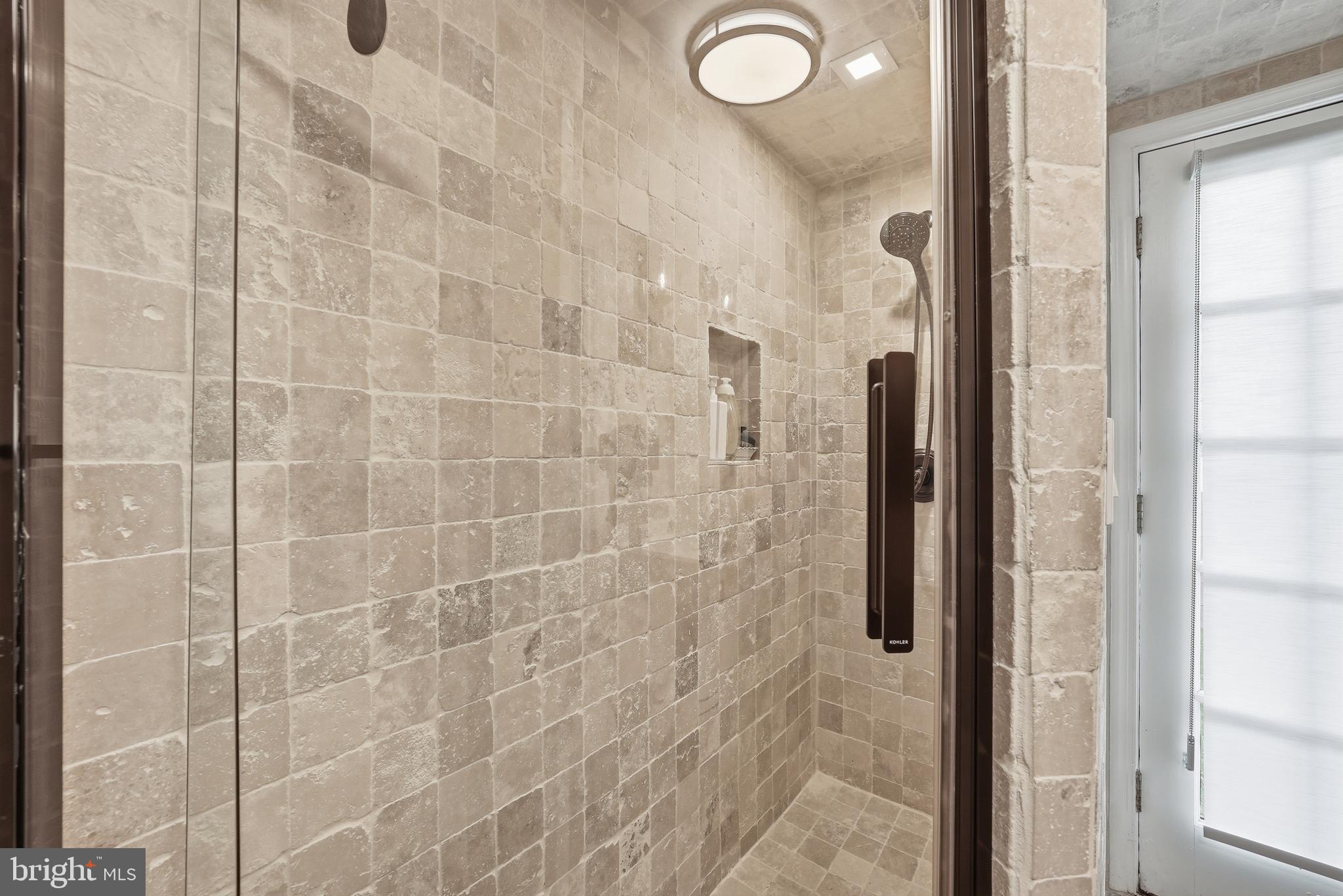 10712 Lockland Road Potomac, MD 20854 - Photo 48 of 66 a bathroom with a shower
