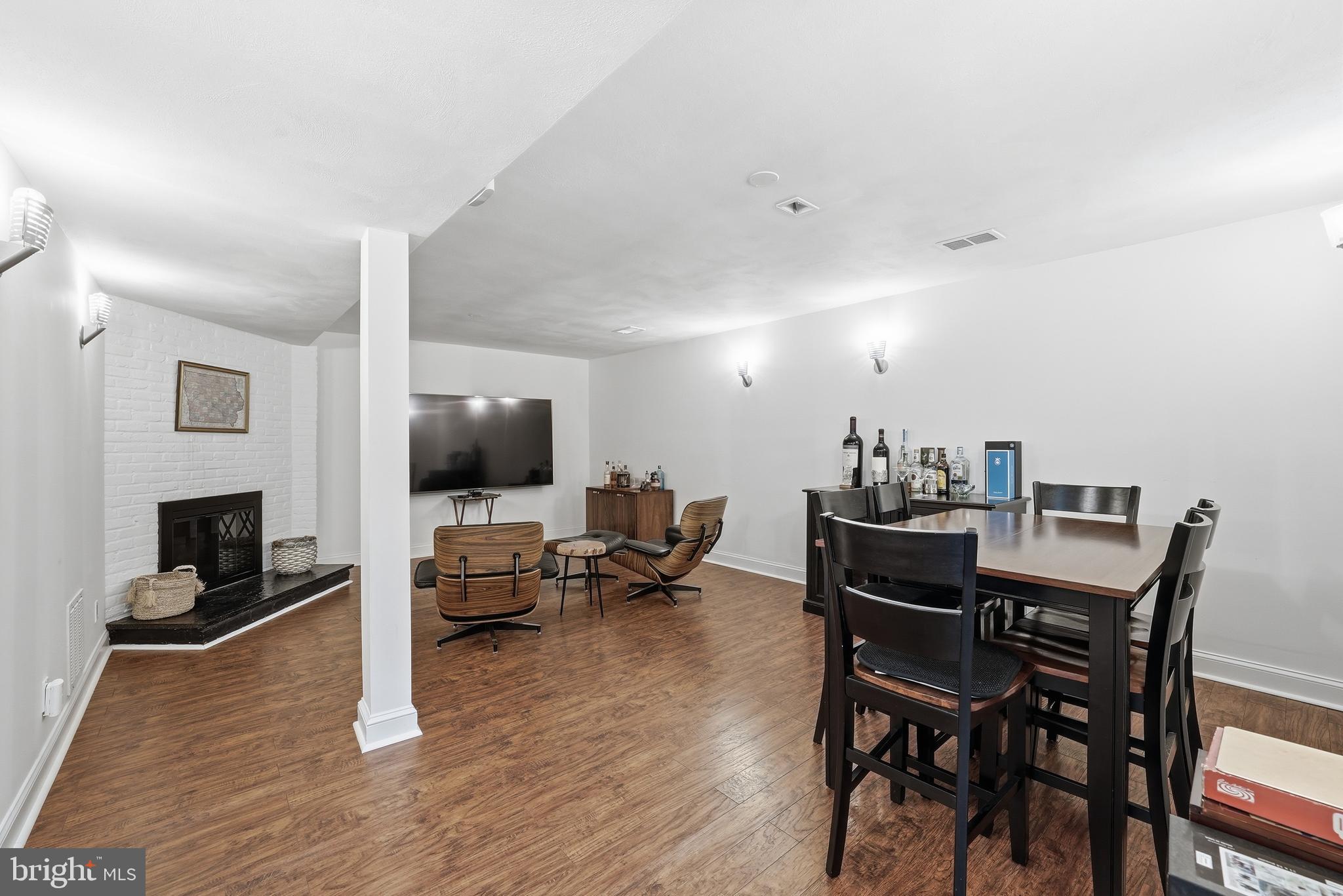 10712 Lockland Road Potomac, MD 20854 - Photo 49 of 66 a living room with furniture and a flat screen tv