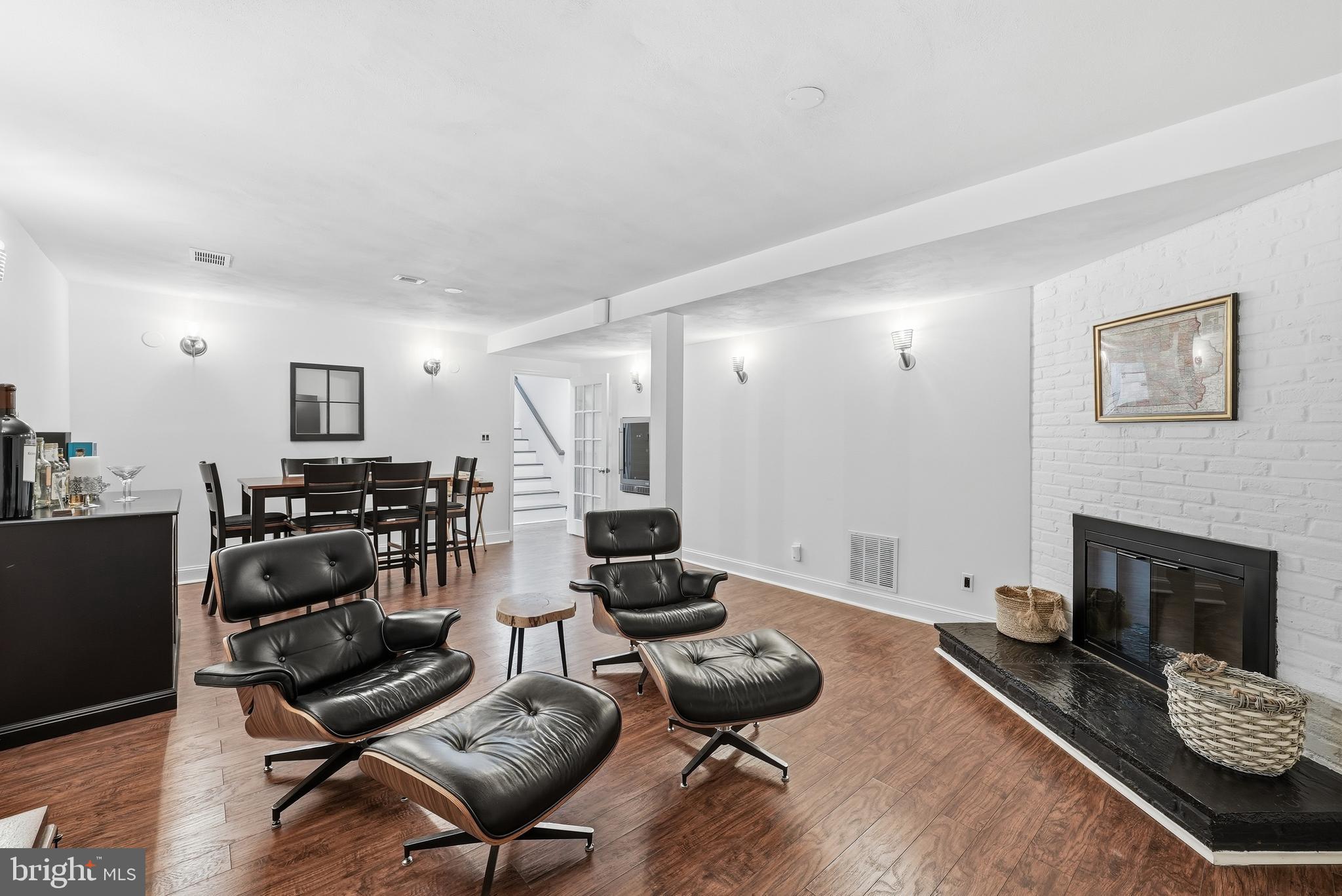 10712 Lockland Road Potomac, MD 20854 - Photo 51 of 66 a view of a livingroom with furniture and a fireplace