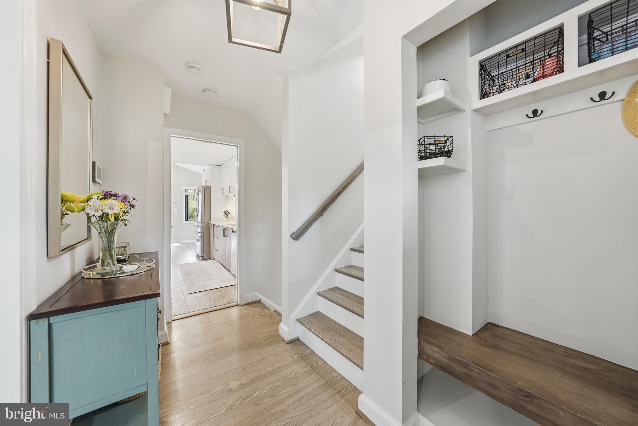 10712 Lockland Road Potomac, MD 20854 - Photo 8 of 66 a view of entryway and hall with wooden floor