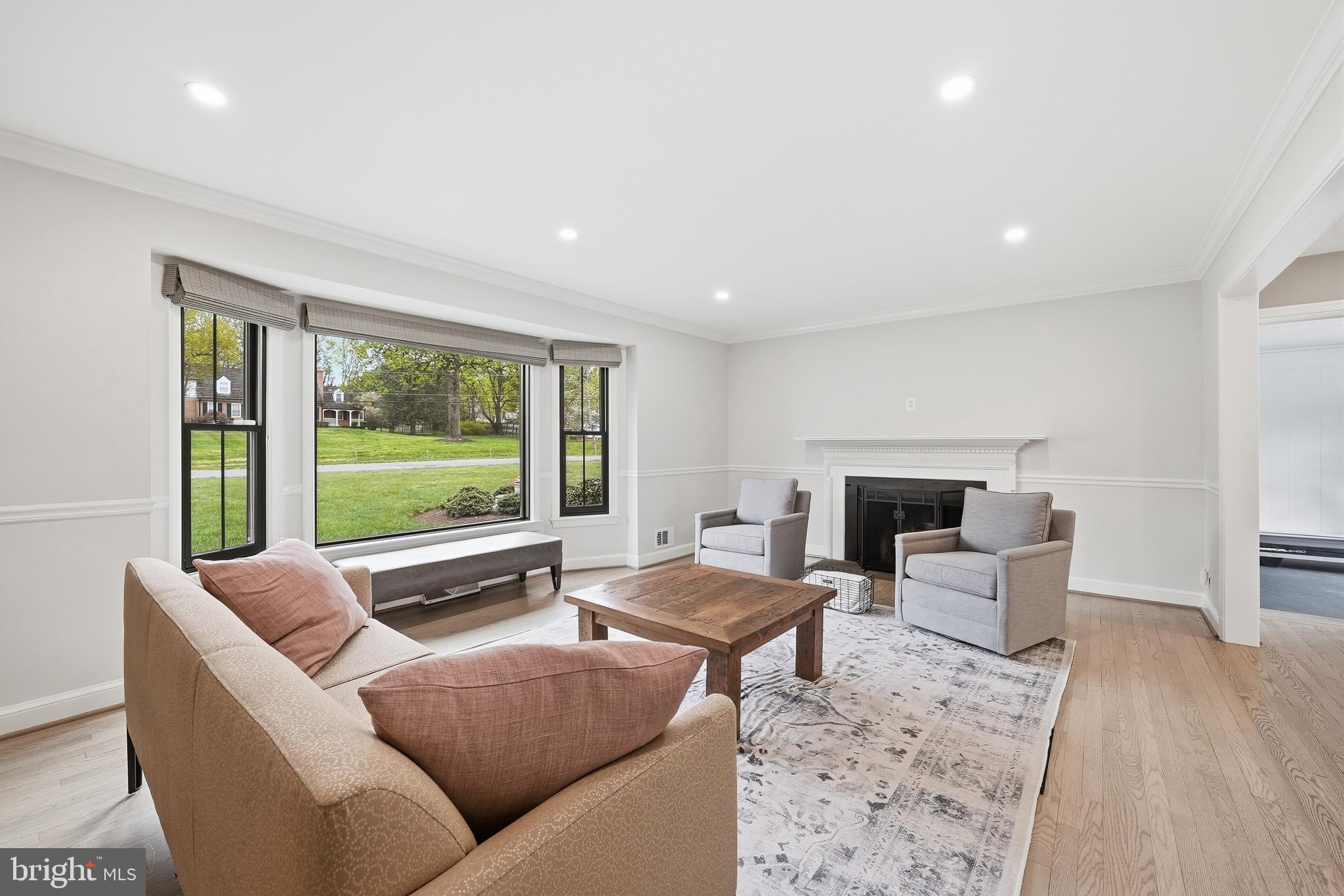 10712 Lockland Road Potomac, MD 20854 - Photo 10 of 66 a living room with furniture and a fireplace