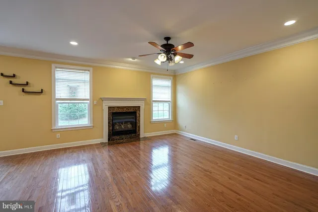 an open kitchen with sink and refrigerator