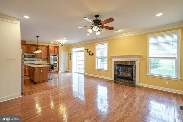 a view of a kitchen with a sink and a refrigerator