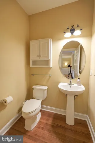 a view of room with window and wooden floor