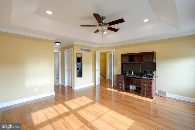 a spacious bathroom with a double vanity sink and a mirror