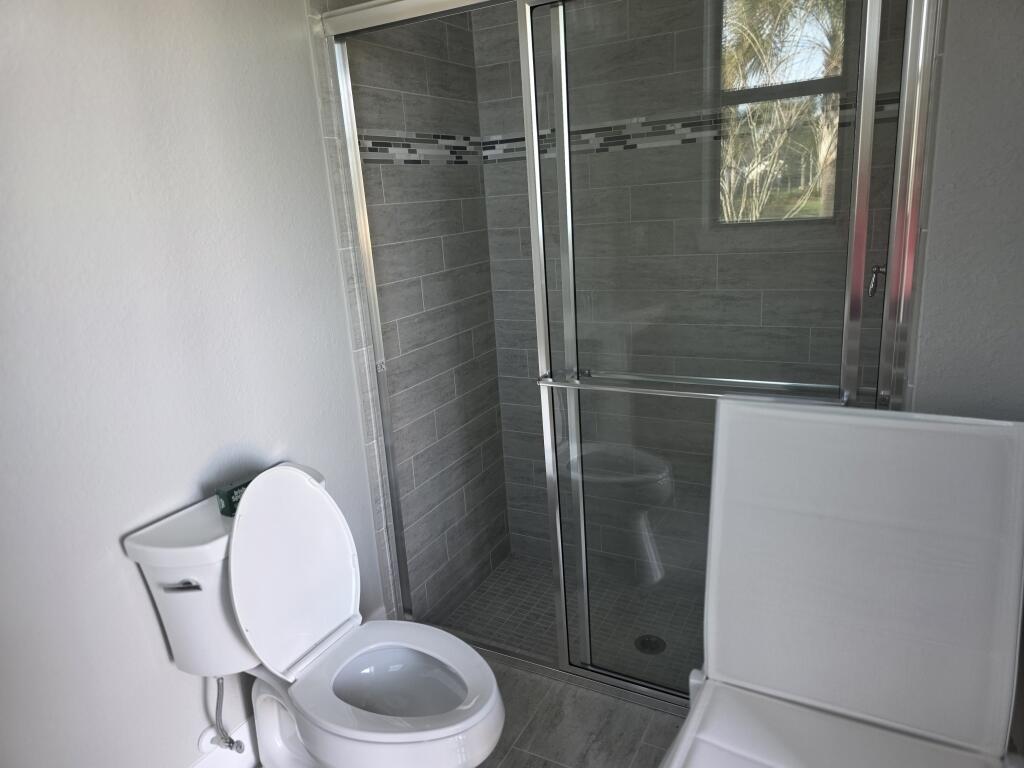 527 Southeast Vallarta Dr Port Port St. Lucie, FL 34984 - Photo 29 of 59 30-Exterior Full Bath