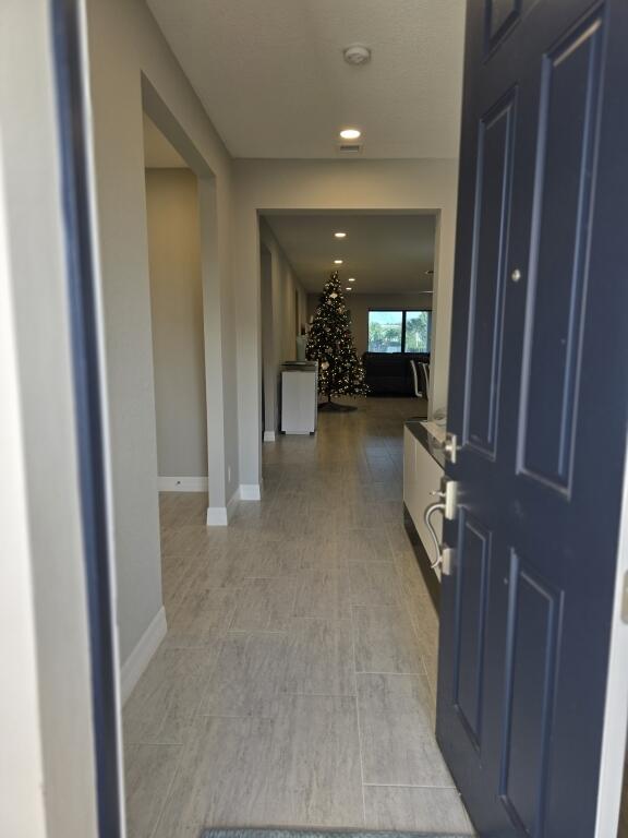 527 Southeast Vallarta Dr Port Port St. Lucie, FL 34984 - Photo 3 of 59 03-Front Entrance