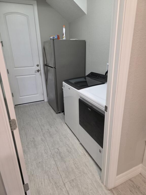 527 Southeast Vallarta Dr Port Port St. Lucie, FL 34984 - Photo 44 of 59 46-Laundry