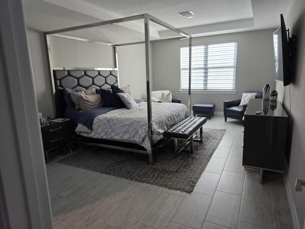 527 Southeast Vallarta Dr Port Port St. Lucie, FL 34984 - Photo 9 of 59 09-Master Bedroom