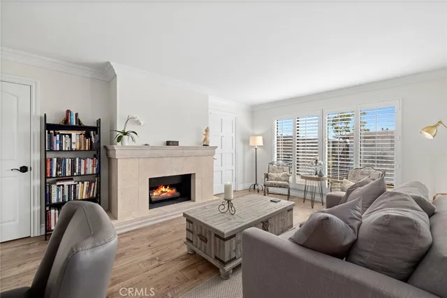 a living room with furniture fireplace and book shelf