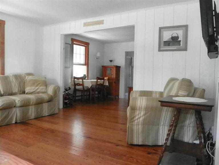 104 Cannon Hill Road Wellfleet, MA 02667 - Photo 17 of 30 a living room with furniture and a window