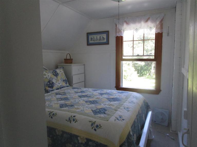104 Cannon Hill Road Wellfleet, MA 02667 - Photo 20 of 30 a bedroom with a bed and a window