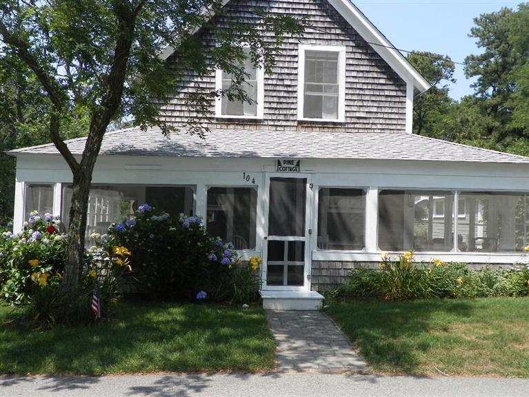 104 Cannon Hill Road Wellfleet, MA 02667 - Photo 3 of 30 a front view of a house with a yard