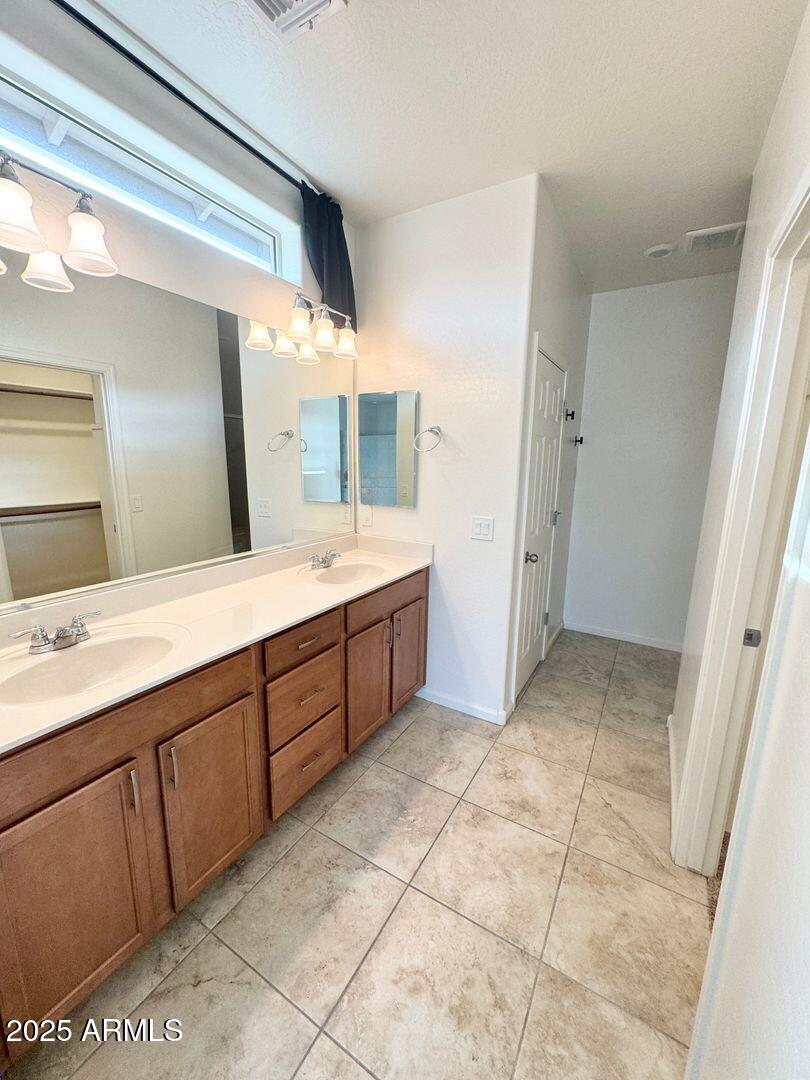 3870 East Balsam Drive Chandler, AZ 85286 - Photo 17 of 39 a spacious bathroom with a double vanity sink mirror and
