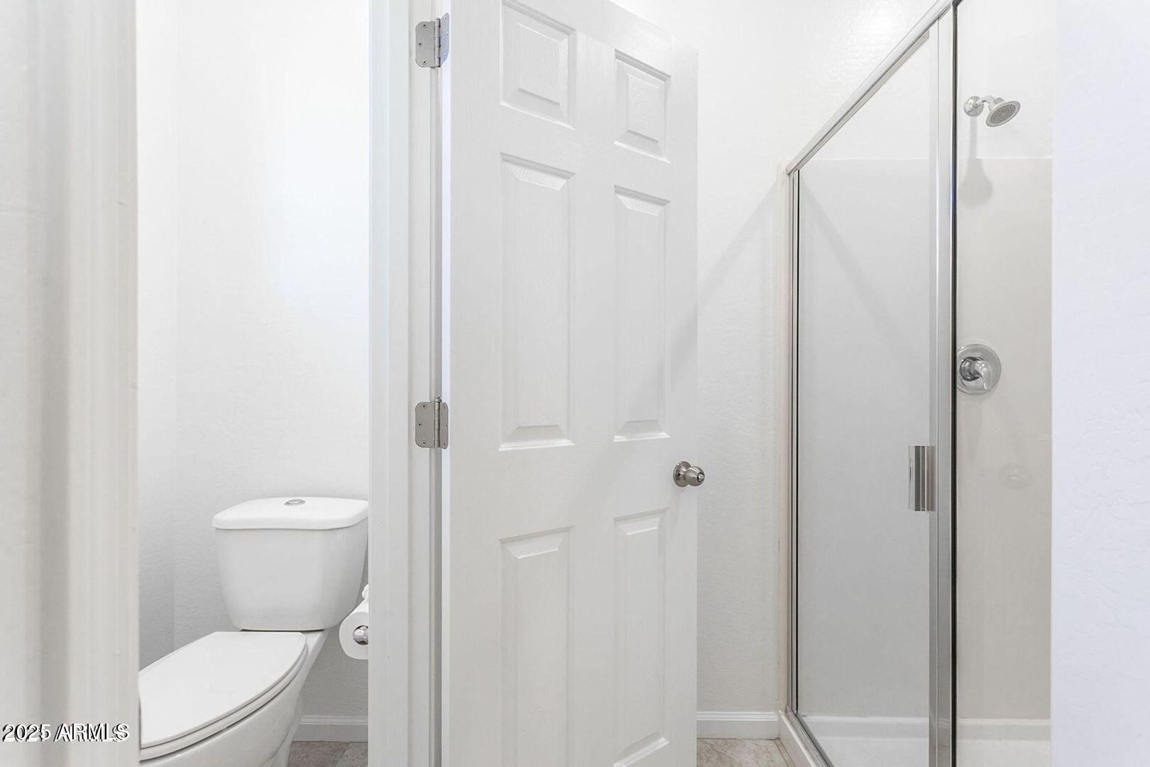 3870 East Balsam Drive Chandler, AZ 85286 - Photo 20 of 39 a bathroom with a toilet and a shower