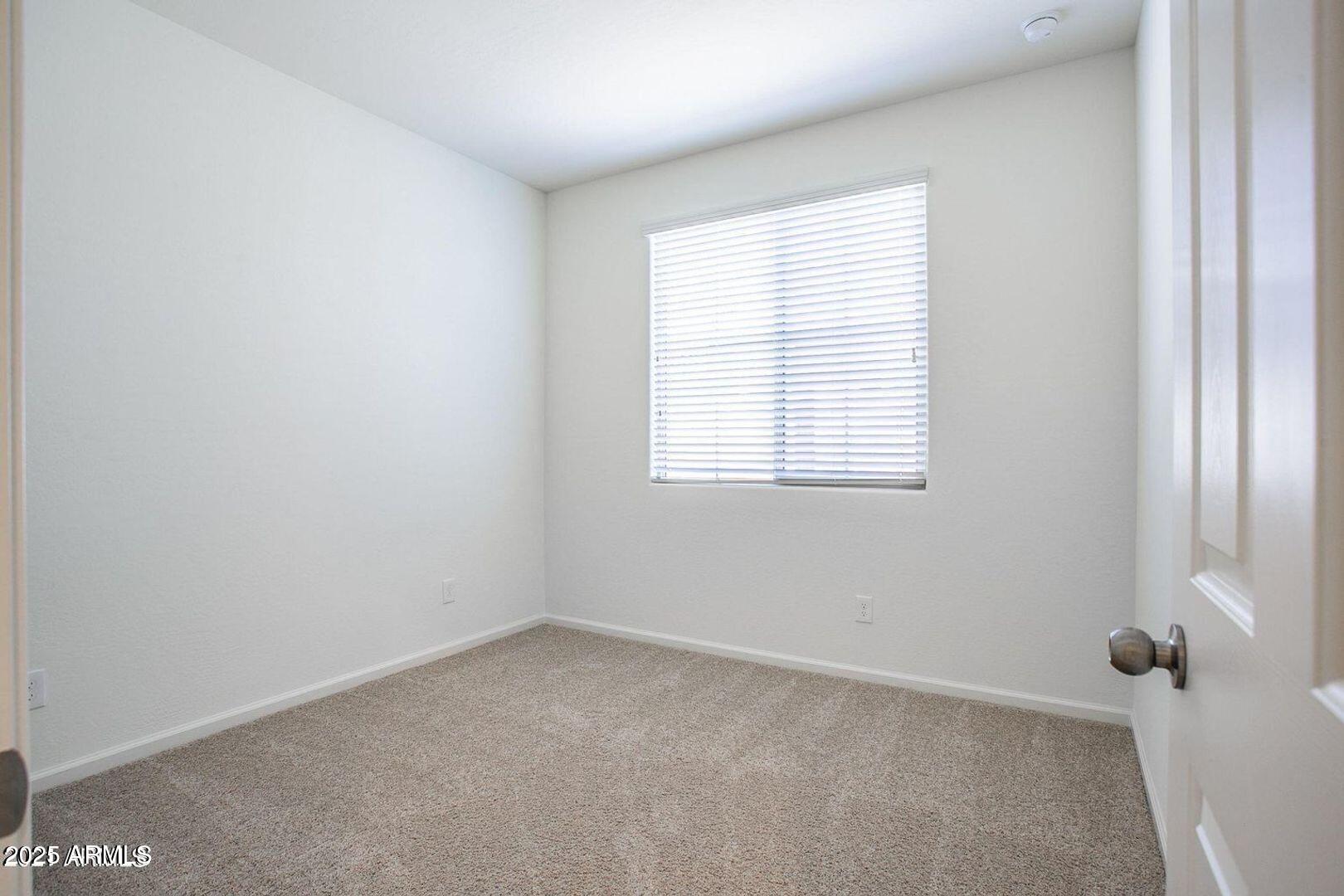 3870 East Balsam Drive Chandler, AZ 85286 - Photo 26 of 39 an empty room with a window