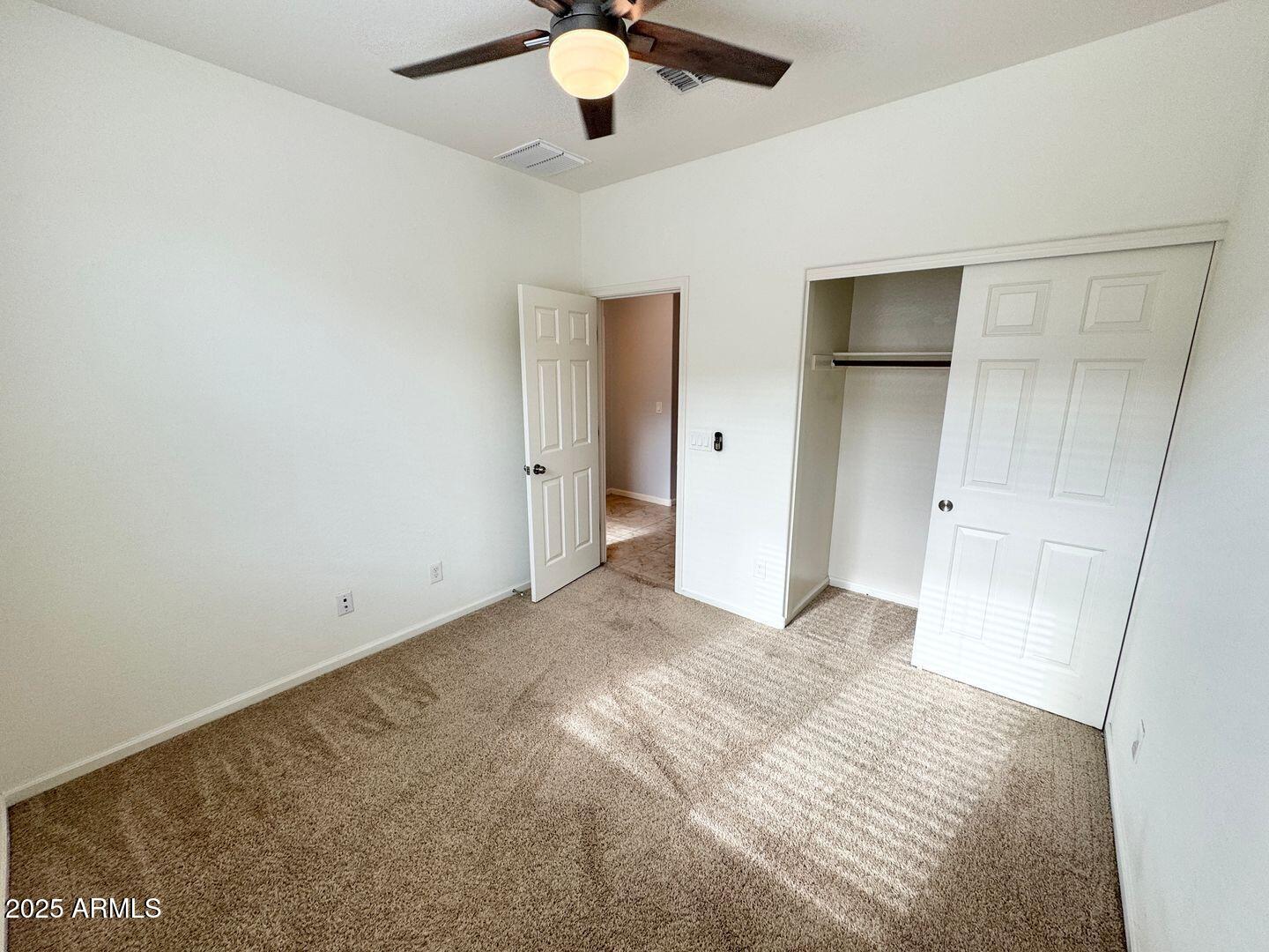 3870 East Balsam Drive Chandler, AZ 85286 - Photo 28 of 39 a view of empty room with wooden floor