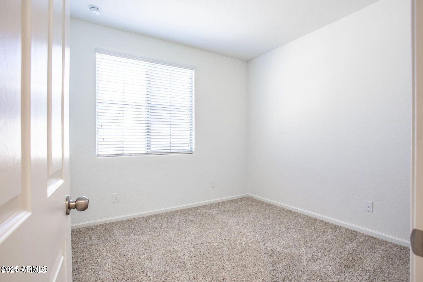 3870 East Balsam Drive Chandler, AZ 85286 - Photo 29 of 39 an empty room with windows