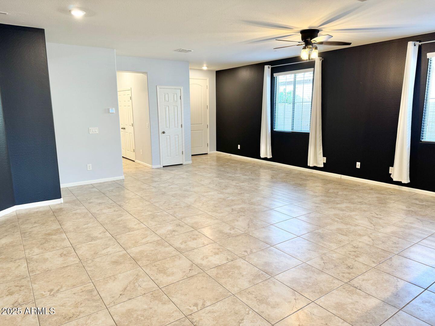 3870 East Balsam Drive Chandler, AZ 85286 - Photo 6 of 39 a view of an empty room with wooden floor