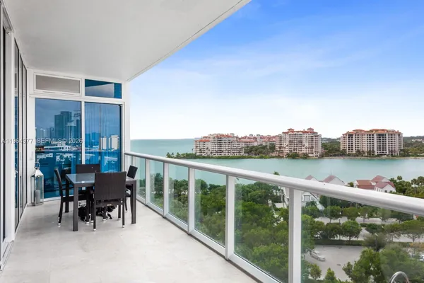 a view of a chairs and table in patio
