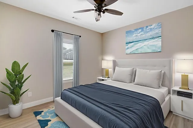 a bedroom with bed and a window