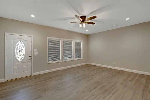 a view of an empty room with a window