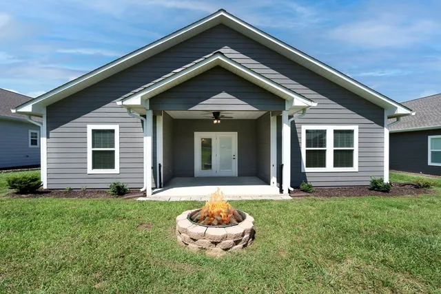 a view of a street with a garden