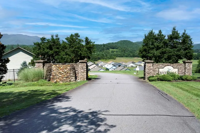 an aerial view of residential house with outdoor space and river
