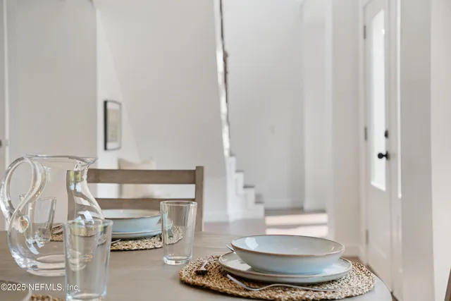 a living room with furniture and a mirror